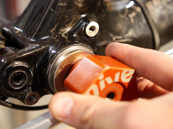 Use a bearing press to slowly press in the BB cup, by sure the cup goes in straight