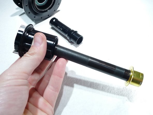 Lightly grease steel axle