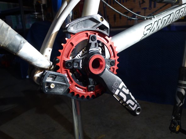 Reinstall the lower slider and adjust it into the proper chainring size position using the marks on the back of the bashguard, torque to 0.9nm