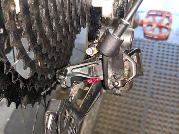 Make sure the shifter is shifted to the highest gear (smallest cog) by pressing the small shift release lever repeatedly, then install a new cable in your shifter. Route the cable through the shift housing to the derailleur.