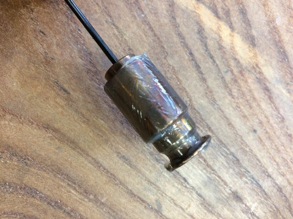 Lightly grease the cam and cam bushing using Slick Honey or Slickoleum grease and slide the assembly into the pillar tube