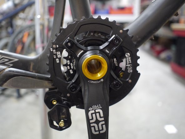 Slide the cranks back into the drive side BB cup and close the lower slider