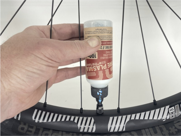 Install tire on rim, fully seating both beads.