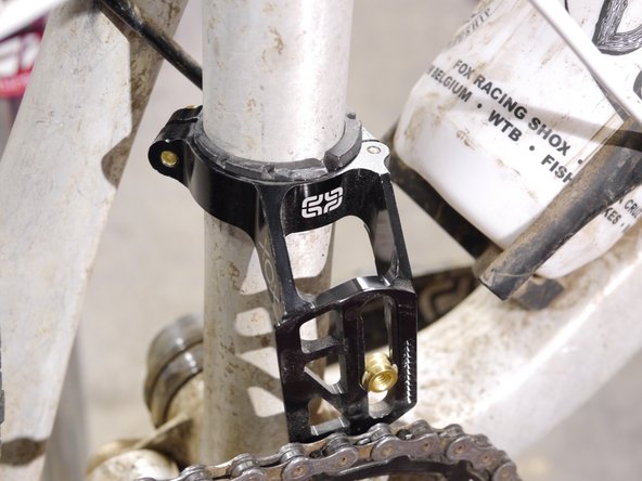 Be sure the slider is in line with the chainring (line up the seams on the slider with the ring)