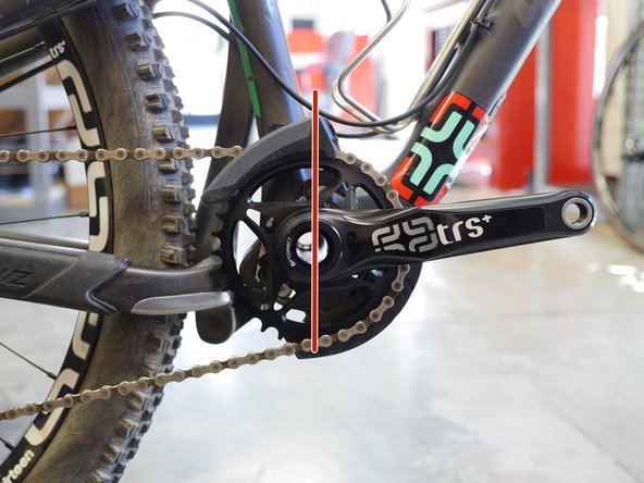 When the guide is centered over the chain ring, rotate the guide such that the upper slider fixing bolt is in the 12 o’clock position