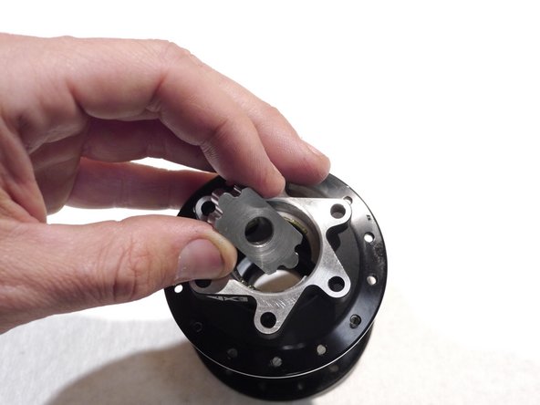 Make sure the wings on the tool are in the cut outs. This will press the bearing out by its outer race