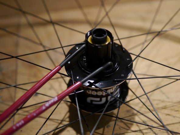 Put one drop of freehub oil on the rubber dust seal and install the freehub dust seal lockring