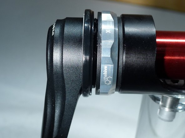 Hand tighten the APS adjuster until no side to side play is felt in the spindle