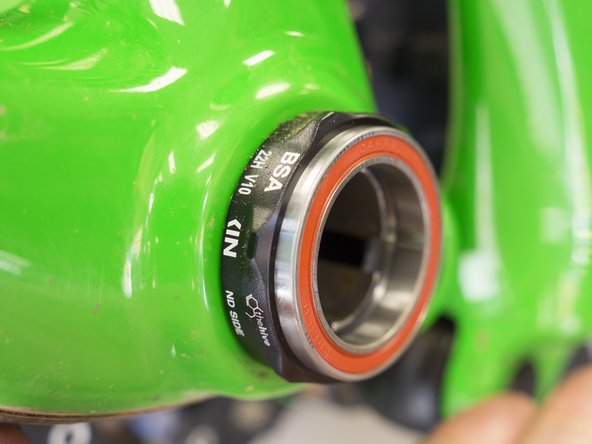 Lightly press a new 6806 bearing into the cup