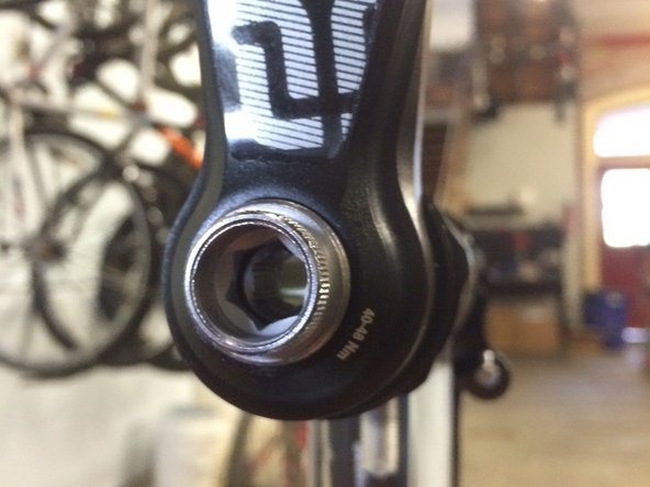 Tighten using a 10mm hex wrench until snug, do not over tighten but be sure the tool is bottomed out inside the arm