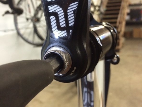 Tighten using a 10mm hex wrench until snug, do not over tighten but be sure the tool is bottomed out inside the arm