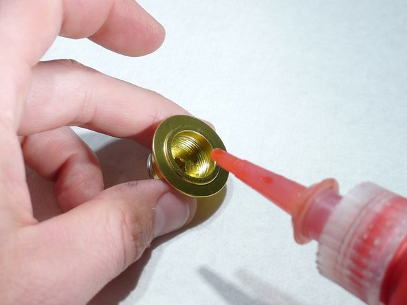 Put two drops of high strength thread locker on endcap threads