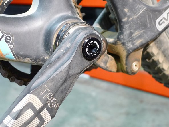 Thread the tool into the non-drive arm until the tool bottoms out