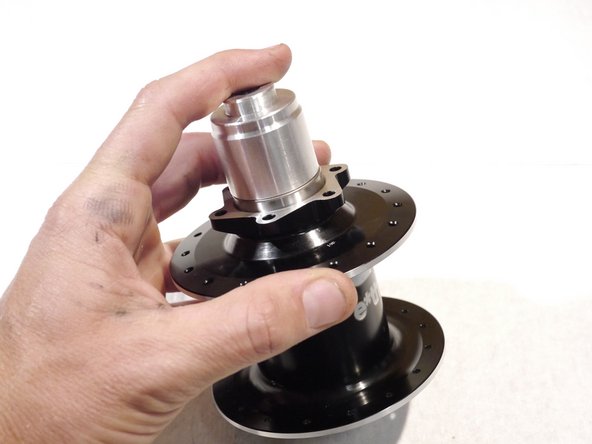 Slide the bearing over the bearing press tool