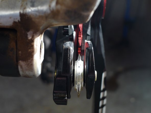 The same number of spacers should be used under each of the three mounting bolts