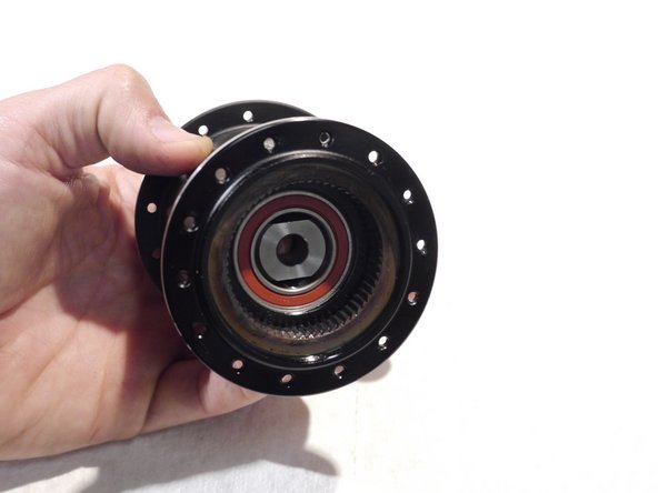 Slide the threaded rod through the hub and the removal tool