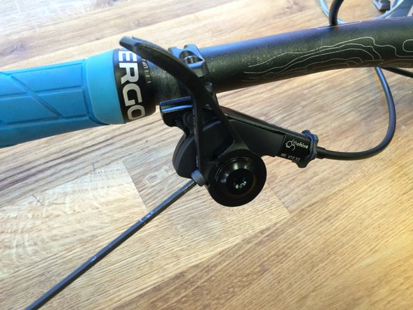 With the lever installed on the bike, adjust the paddle position to your preference and tighten the screw to 1N*m