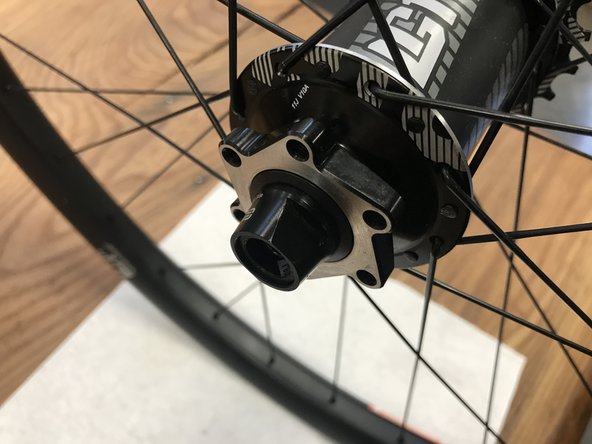 Install non-drive side axle endcap.