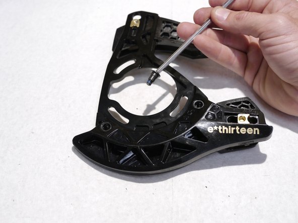 reinstall the lower roller and slider, note the positions for different chainring sizes