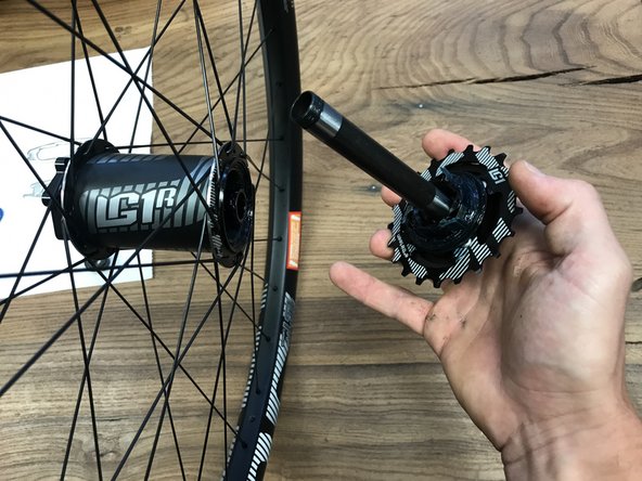 Once you have replaced or serviced your 7 speed freehub. You can insert the axle and cassette/freehub back into the hubshell.