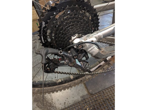 Note that before adjusting the low gear stop screw it may be possible to shift the chain into the spokes! Shift carefully during this process!