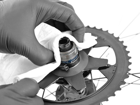 Use a paper towel to firmly grasp the bushing and remove.