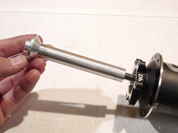 Slide the press rod over the threaded rod and onto the removal tool