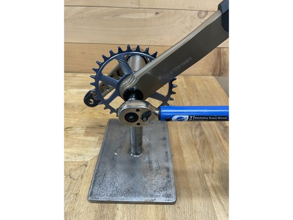 Using a torque wrench and 8mm hex bit, tighten the crankbolt on the driveside arm to 40-45Nm.