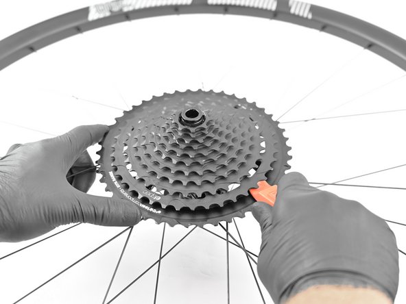 While firmly holding the chainwhip turn the cassette lockring tool counter clockwise to unlock.