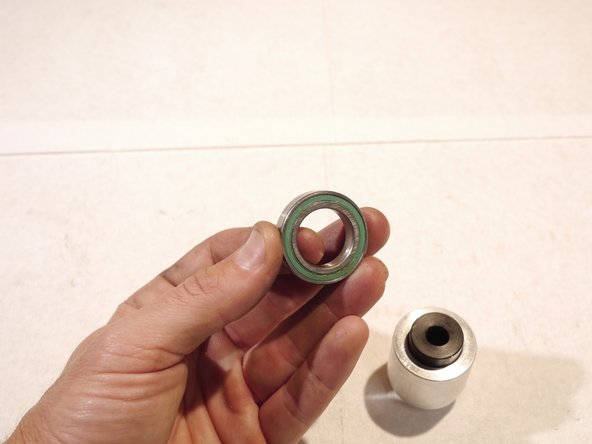 Insert the black bearing centering tool into the bearing tool