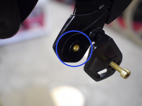 Release the lower slider by lifting the tab on the back of the slider and pulling the bottom of the slider out