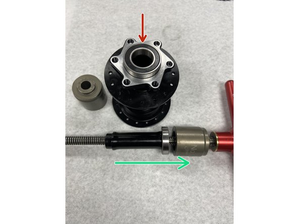 Before installing new bearings, thoroughly clean bearing bores on the hub shell. You can also add a small amount of Loctite to the clean bore before pressing the bearing in, as an optional safeguard.