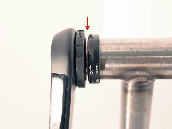 There should be a 1-2mm gap between the APS adjuster and bottom bracket.