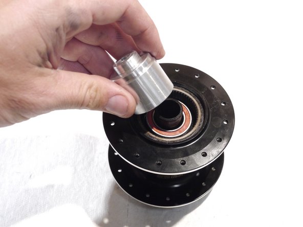 Slide the bearing over the end of the bearing spacer