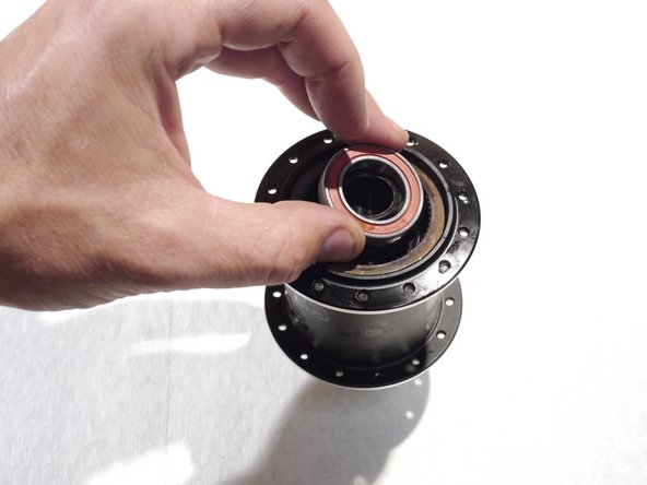 Slide the bearing over the end of the bearing spacer