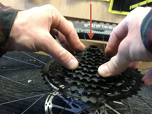 Align the arrow on the 28t cog of the steel portion with the unlocked logo on the 33t cog on the alloy portion. Push down firmly on the steel portion of the cassette to slide it down onto the XD™ driver. You may need to wiggle it slightly to get it to seat fully.