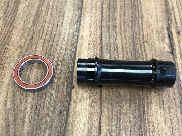 Slide the remaining bearing onto the axle sleeve