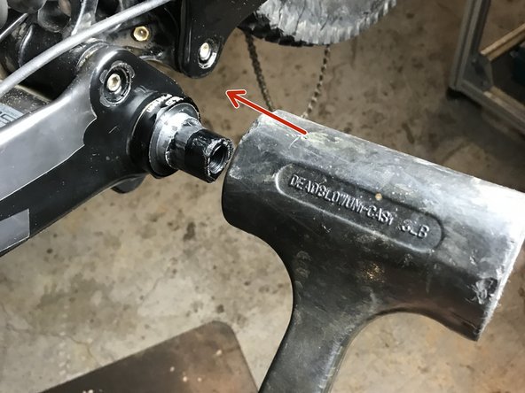 To remove the drive side crank arm you may need to lightly tap the spindle with a rubber mallet.