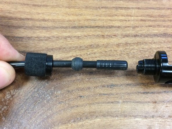 Slip the rubber wedge over the housing