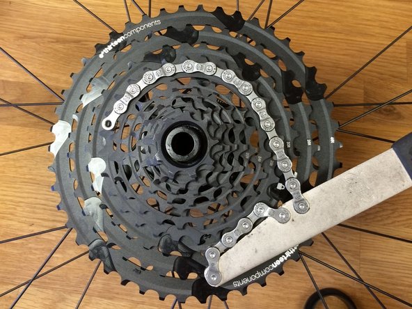 Using a chainwhip, turn the steel sprocket assembly clockwise to lock it in place.