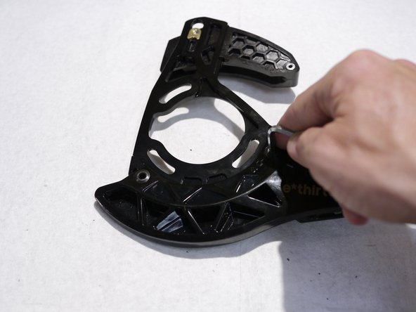 To remove the direct mount bashguard, remove the fixing bolts from the back of the guide