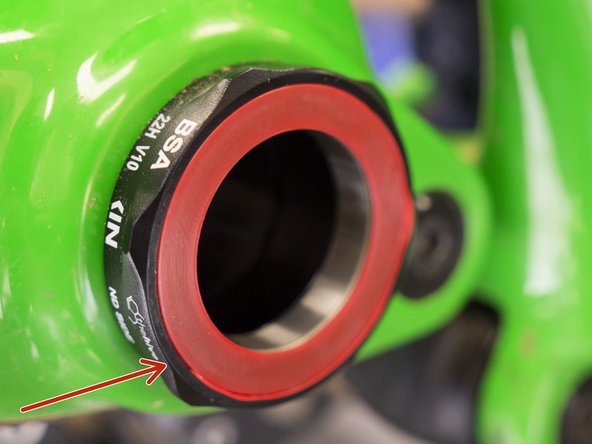 Working around the outer diameter of the seal, tuck the lip of the seal into the groove in the BB cup