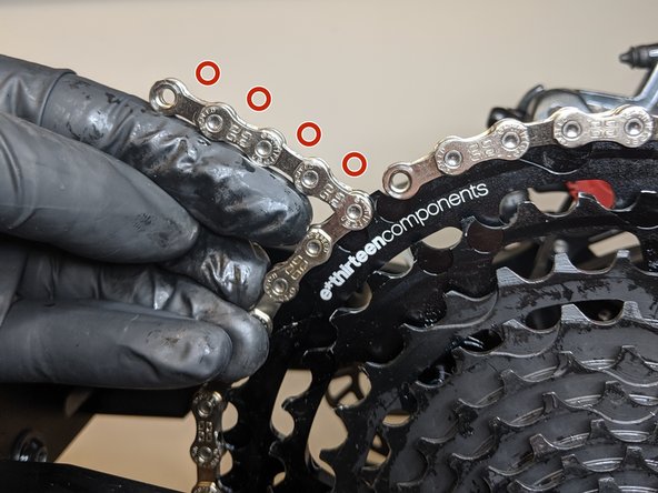 For Full Suspension bikes - Add 5 or 6 links of extra chain so that the chain will end on a narrow-link.