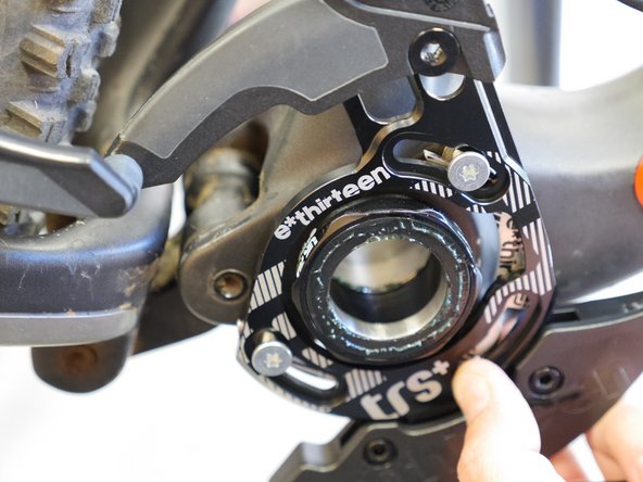 It may be necessary to remove the cranks to adjust the guide. However, in many cases it is possible to reach a T25 torx wrench through the chain ring to tighten and loosen the ISCG mounting screws.
