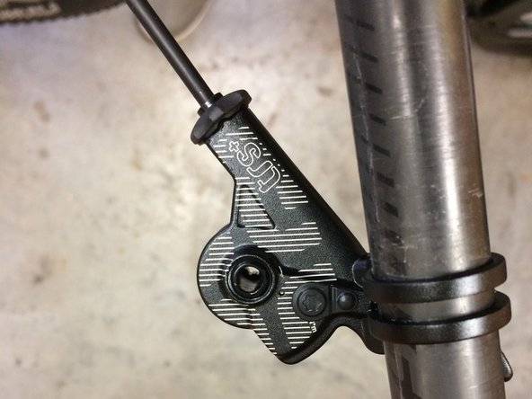 Moving to the front of the bike, install the lever onto your handle bar.