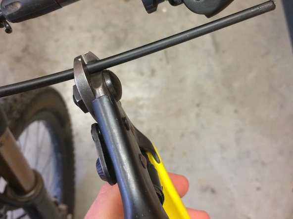 Check that the mark you made on the lever end of the housing is still accessible from outside the frame. This will come in handy later if you need to remove the post for any reason you can just remove the lever from the bar. If you need to add length to the housing to accommodate this, do so now.