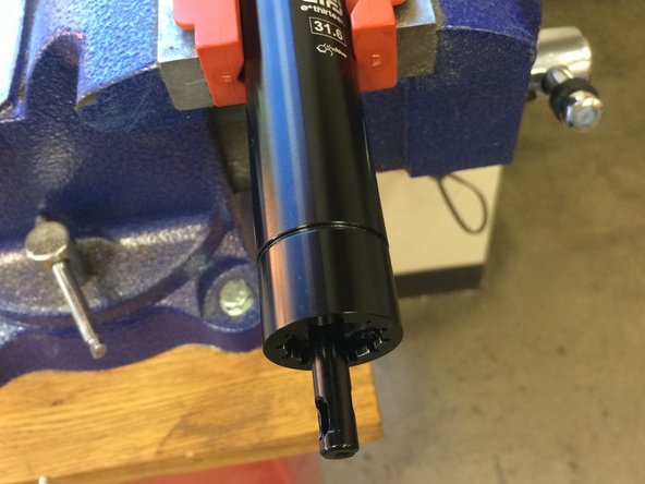 Clamp the seatpost in softjaws or use a strap wench to hold the post