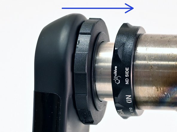 Inspect the APS adjuster to ensure that it is fully seated on the arm.