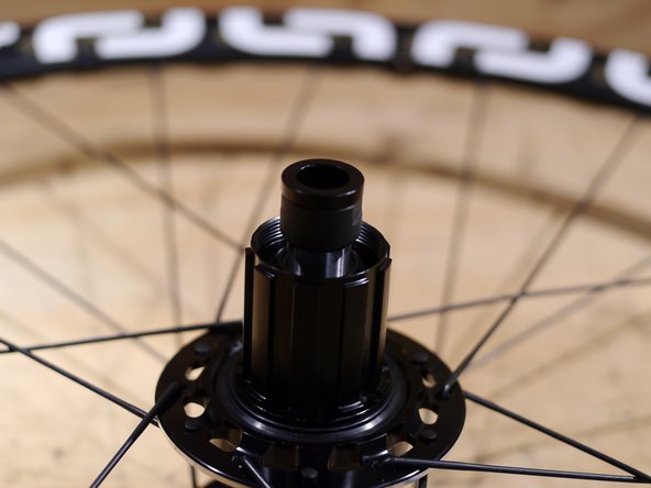 Slide the steel axle out of the drive side of the hub