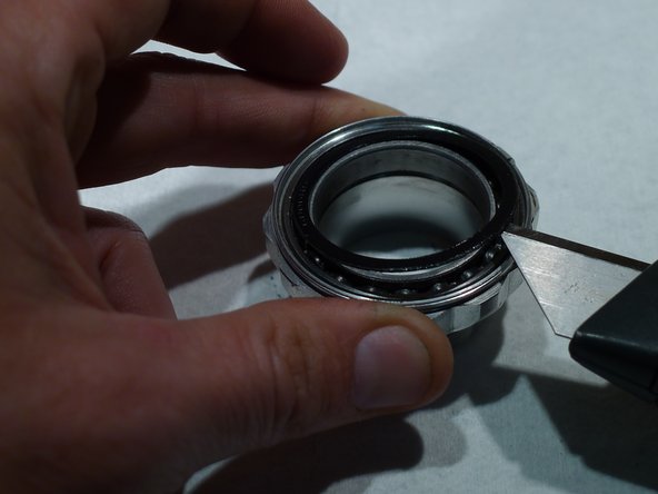 Be careful not to bend the seal while removing it